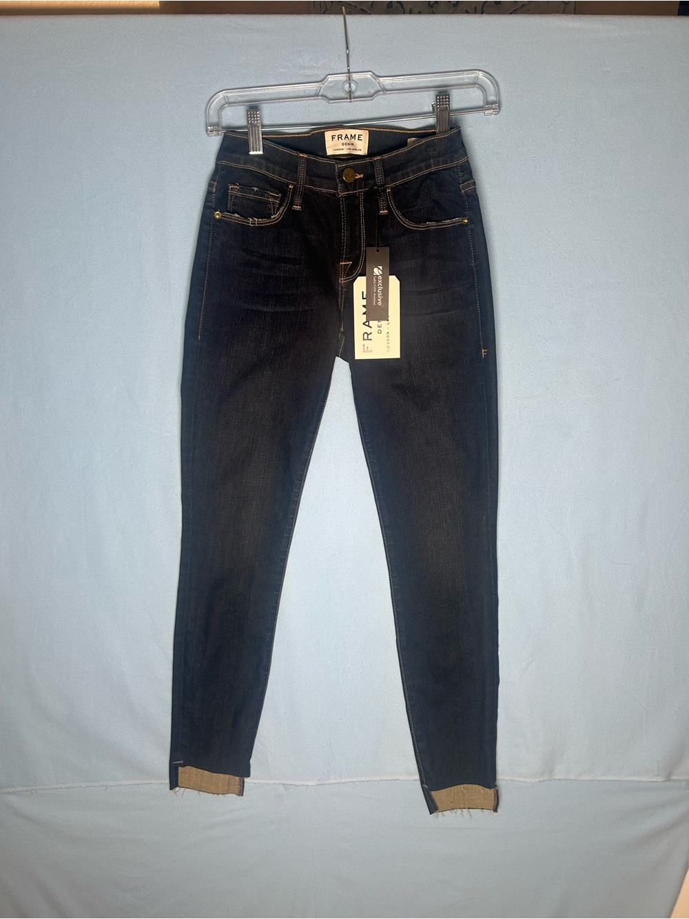 Frame Denim Indigo Skinny Jeans. Distressed at ankles for a celebrity 25 waist